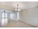 Bright dining room featuring a modern chandelier and neutral tile flooring at , Henderson, NV 89015