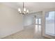 Bright dining room featuring neutral tile flooring and window with blinds at , Henderson, NV 89015