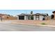 Charming single story house with a black garage door and low maintenance landscaping at , Henderson, NV 89015