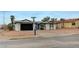 Charming single story house with a black garage door and low maintenance landscaping at , Henderson, NV 89015