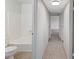 Hallway view leading to bedroom, featuring tile floors and access to a bathroom at , Henderson, NV 89015