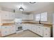 Kitchen features white cabinets, wood countertops, tile flooring, and recessed lighting at , Henderson, NV 89015