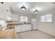 Cozy kitchen features white cabinets, wood countertops and tile flooring at , Henderson, NV 89015