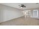 Open living room with tile flooring, ceiling fan, and view of the kitchen at , Henderson, NV 89015