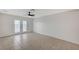 Bright living room featuring tile flooring, a ceiling fan, and sliding glass doors at , Henderson, NV 89015