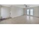 Spacious living room featuring tile flooring, a ceiling fan, and sliding glass doors at , Henderson, NV 89015
