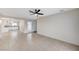 Open living room with tile flooring, ceiling fan, and view of the kitchen at , Henderson, NV 89015