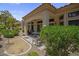 Cozy covered back patio with desert landscaping offering privacy and shade for outdoor relaxation at 10017 Bundella Dr, Las Vegas, NV 89134