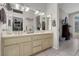 Bathroom with double sinks, vanity area, and a view into the connected room at 10017 Bundella Dr, Las Vegas, NV 89134