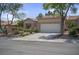 Charming single-story home with well-maintained desert landscaping and a two-car garage at 10017 Bundella Dr, Las Vegas, NV 89134