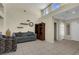 Bright living room with tile floors, high ceilings, and decorative shelves at 10017 Bundella Dr, Las Vegas, NV 89134