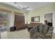 Relaxing living room featuring tile floors, sofas, and backyard access at 10017 Bundella Dr, Las Vegas, NV 89134