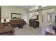 Open living room featuring sofas, a TV stand, and access to other rooms at 10017 Bundella Dr, Las Vegas, NV 89134