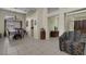 Open-concept living and dining area with tile flooring and neutral paint at 10017 Bundella Dr, Las Vegas, NV 89134