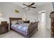 Main bedroom featuring a ceiling fan, tile floor, and furnishings at 10017 Bundella Dr, Las Vegas, NV 89134
