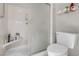 Modern bathroom featuring a toilet, a shower, a built-in shelf, and practical shelving at 10017 Bundella Dr, Las Vegas, NV 89134