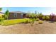 Spacious backyard featuring lush green grass, gravel, and low-maintenance landscaping at 10711 Silver Pond Ave, Las Vegas, NV 89135