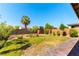 Expansive backyard with a well-maintained lawn, mature trees, and brick-paved patio at 10711 Silver Pond Ave, Las Vegas, NV 89135
