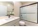 Well-lit bathroom featuring a shower-tub combo, bright vanity, and modern fixtures at 10711 Silver Pond Ave, Las Vegas, NV 89135