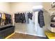 Organized walk-in closet with ample hanging space and shelving for optimal storage solutions at 10711 Silver Pond Ave, Las Vegas, NV 89135
