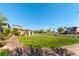 Inviting community park featuring green space, walking path, and a pergola in a residential neighborhood at 10711 Silver Pond Ave, Las Vegas, NV 89135