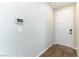 Entryway featuring hardwood floors, a wall-mounted security panel, and a white door at 10711 Silver Pond Ave, Las Vegas, NV 89135