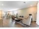 Spacious living room adjacent to the kitchen, featuring hardwood floors and stylish decor at 10711 Silver Pond Ave, Las Vegas, NV 89135