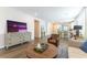 Well-lit living room featuring hardwood floors and modern furniture creating an inviting atmosphere at 10711 Silver Pond Ave, Las Vegas, NV 89135