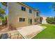 Spacious backyard featuring a patio, lush lawn and multi-level design at 10716 Aire Dr, Las Vegas, NV 89144