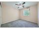 Comfortable bedroom with ceiling fan, plush carpeting, and natural light from a window at 10716 Aire Dr, Las Vegas, NV 89144