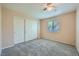 Cozy bedroom features a window, carpet flooring, and a spacious closet at 10716 Aire Dr, Las Vegas, NV 89144
