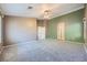 Expansive main bedroom with neutral carpeting, ceiling fan, and en suite bathroom at 10716 Aire Dr, Las Vegas, NV 89144