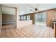 Bright dining room featuring tile floors, backyard access, and lots of natural light at 10716 Aire Dr, Las Vegas, NV 89144
