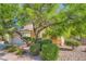 Inviting two-story home featuring mature landscaping, a tiled roof and charming curb appeal at 10716 Aire Dr, Las Vegas, NV 89144