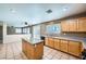 Open kitchen featuring granite countertops, stainless steel appliances and tile flooring at 10716 Aire Dr, Las Vegas, NV 89144