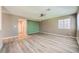 Spacious living room with modern flooring, ceiling fan, and a large window at 10716 Aire Dr, Las Vegas, NV 89144