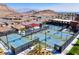 Aerial view of the community's pickleball courts and surrounding neighborhood, set against a mountain backdrop at 10890 Red Yucca Dr, Las Vegas, NV 89138