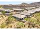 Aerial view showcasing a well-maintained home and its community with mountain backdrop at 10890 Red Yucca Dr, Las Vegas, NV 89138