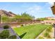 Spacious backyard with artificial grass, patio, and stunning mountain views at 10890 Red Yucca Dr, Las Vegas, NV 89138
