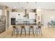 Contemporary kitchen boasts a spacious island with seating, stainless steel appliances, and ample cabinet space at 10890 Red Yucca Dr, Las Vegas, NV 89138