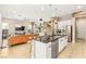 Modern open-concept kitchen with island and stainless steel appliances flows to the living area at 10890 Red Yucca Dr, Las Vegas, NV 89138