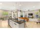 Open-concept kitchen with island and backyard view flowing to the living area at 10890 Red Yucca Dr, Las Vegas, NV 89138