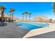 Stunning pool area featuring crystal-clear water, poolside lounging, and scenic mountain backdrop at 10890 Red Yucca Dr, Las Vegas, NV 89138