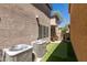 An inviting outdoor space with artificial turf, a putting green, and cozy seating area at 11063 Mount George St, Las Vegas, NV 89179