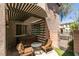 Relaxing backyard oasis featuring a covered patio, hot tub, and cozy seating area at 11063 Mount George St, Las Vegas, NV 89179