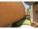 Private backyard showcasing a putting green, hot tub, and a cozy patio area at 11063 Mount George St, Las Vegas, NV 89179