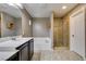 Bright bathroom boasting double sinks, a tub, a glass shower, and ample counter space at 11063 Mount George St, Las Vegas, NV 89179