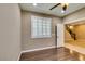 Neutral bedroom featuring an open door to another carpeted room, with views of the staircase at 11063 Mount George St, Las Vegas, NV 89179