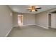 Cozy bedroom featuring plush carpeting, neutral walls, and an en-suite bathroom for convenience at 11063 Mount George St, Las Vegas, NV 89179