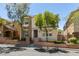 Charming two-story home featuring stone accents, complemented by manicured landscaping and a welcoming entrance at 11063 Mount George St, Las Vegas, NV 89179